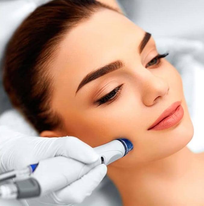 woman receiving hydrafacial