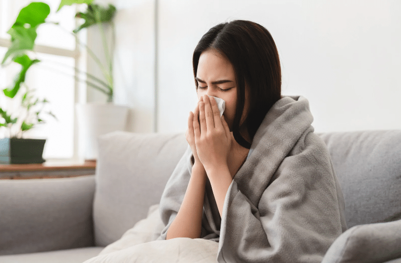 woman blowing nose