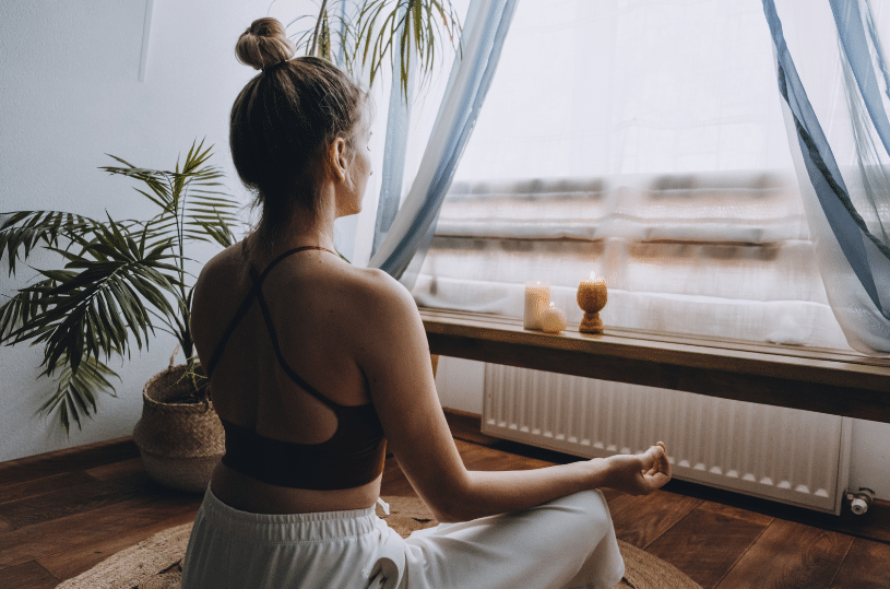 woman doing yoga inside