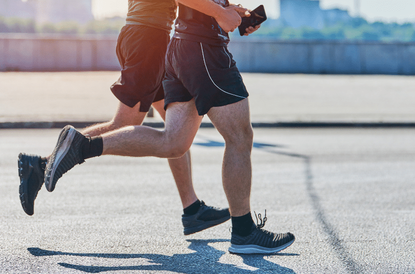 men running outside on concrete