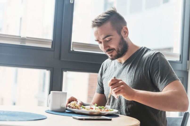 man eating at a restaurant