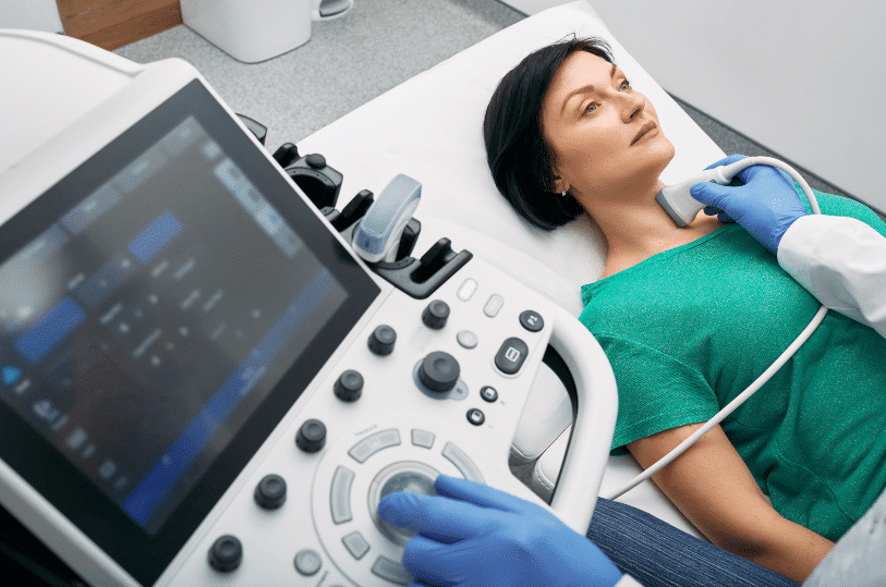 person receiving thyroid scan